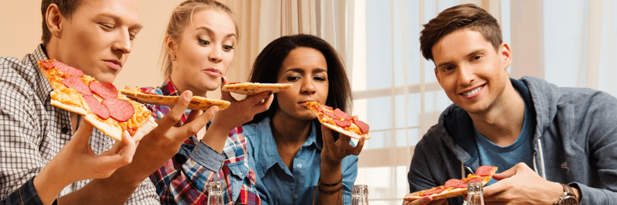 finishing university students eating pizza