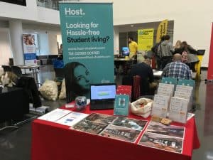 host stand at accommodation fair