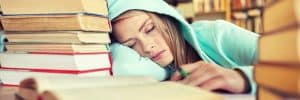 student-sleeping-in-library