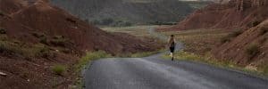 Woman-Jogging-in-Scenic-Road