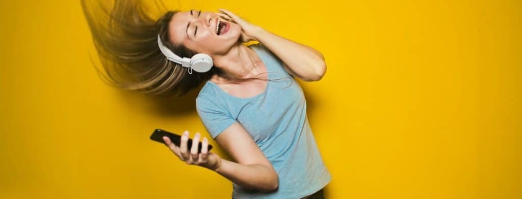 woman-listening-to-music-and-dancing