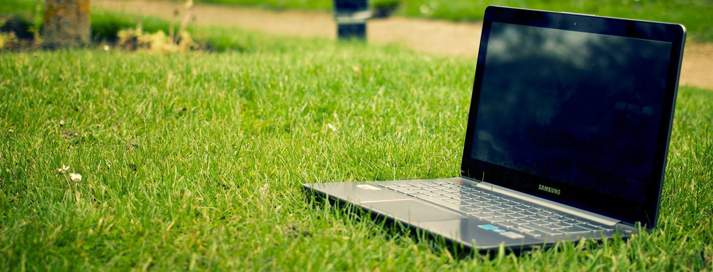 virtual-events-on-laptop-on-grass