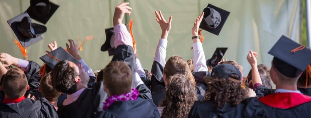 people-graduating-with-hats-in-air
