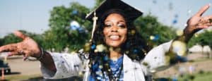 woman-throwing-confetti-with-graduation-cap