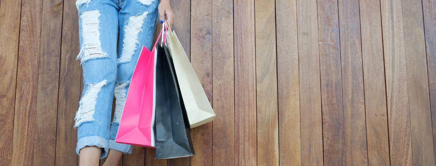 woman holding shopping bags after getting student discounts