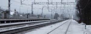 christmas travel snow on train tracks