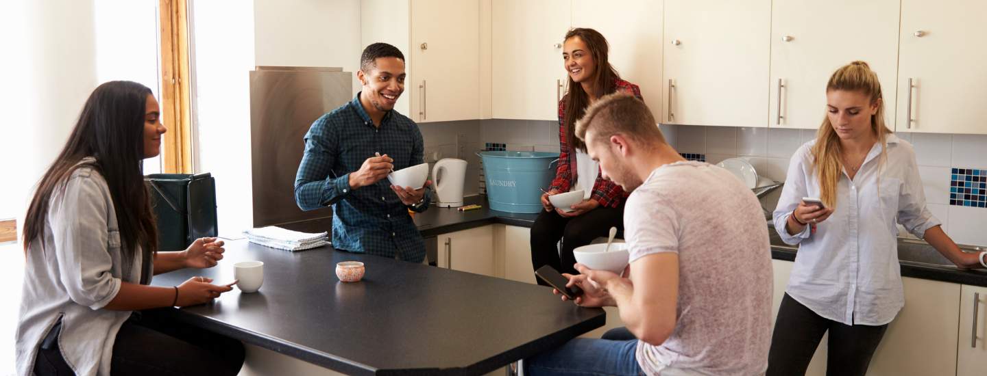 students laughing in accommodation uni mental health day