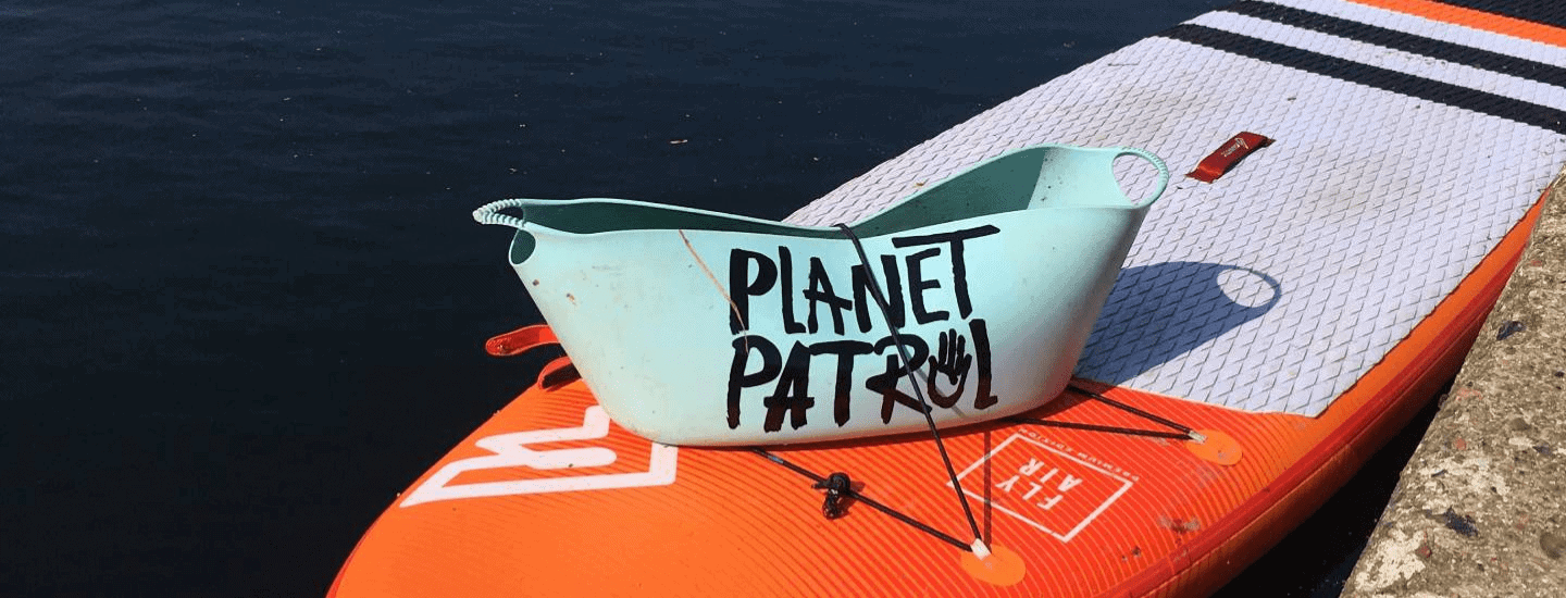 Planet Patrol collector on paddleboard