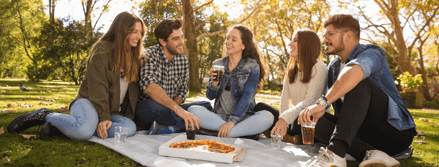 Roadmap to your social life students meeting in a park for pizza and a drink