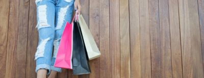 woman holding shopping bags after getting student discounts