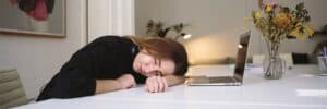 Woman-Sleeping-On-Table