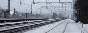 christmas travel snow on train tracks
